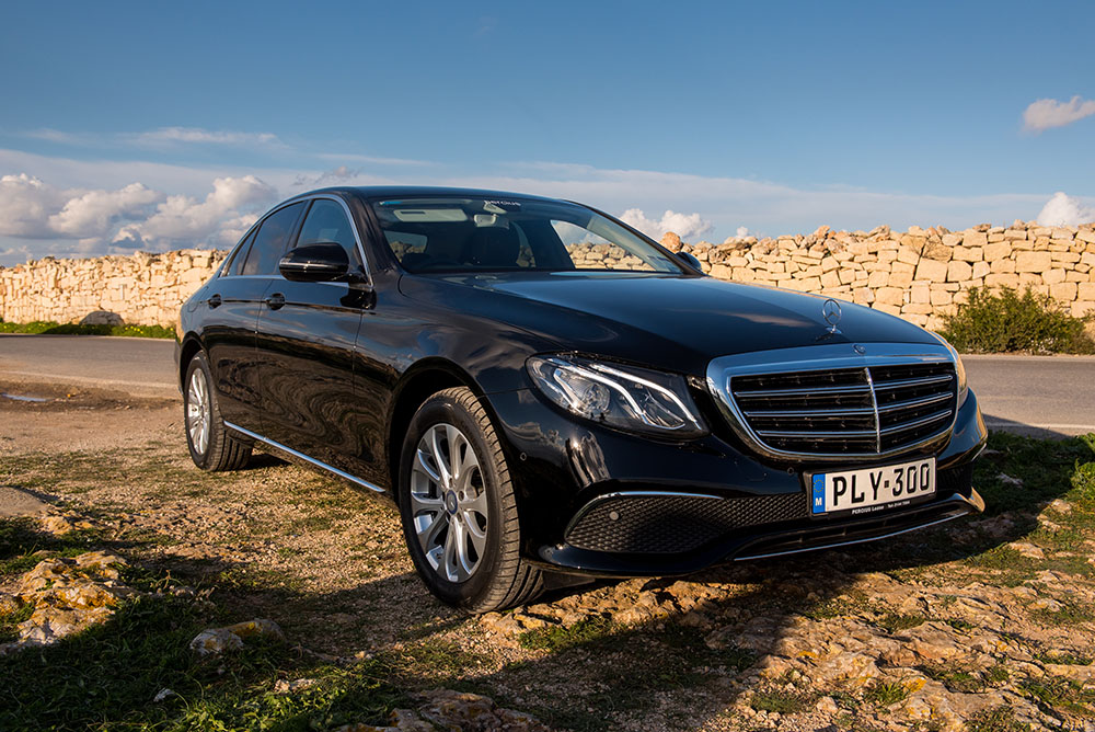 Black Mercedes E-Class chauffeur car